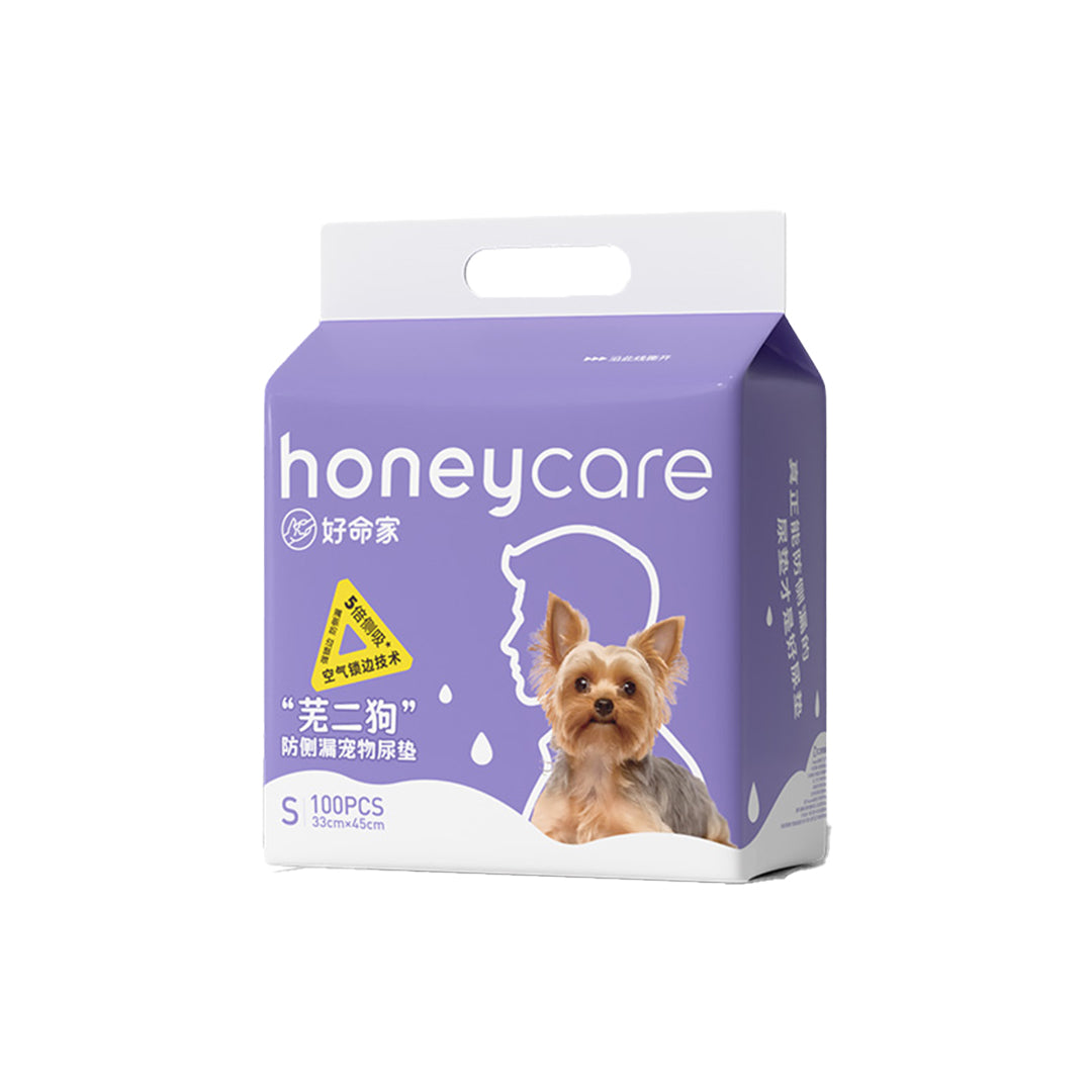Honeycare pet product packaging with a  small dog illustration showing the pack has 100 pieces of pee pads