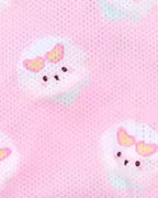 Pink cooking fabric with a repeating pattern of cute bichon frise wearing pink heart-shaped sunglasses.