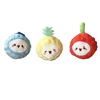 Three small plush fruit characters on a plain light beige background: a blue round fruit with a smiling face, a yellow pineapple-shaped plush with a green top, and a red apple plush with a green stem. A small watermark/logo appears in the lower left corner.