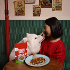 dog eating chicken satay pet treat from Petcubes limited-edition National Day range 