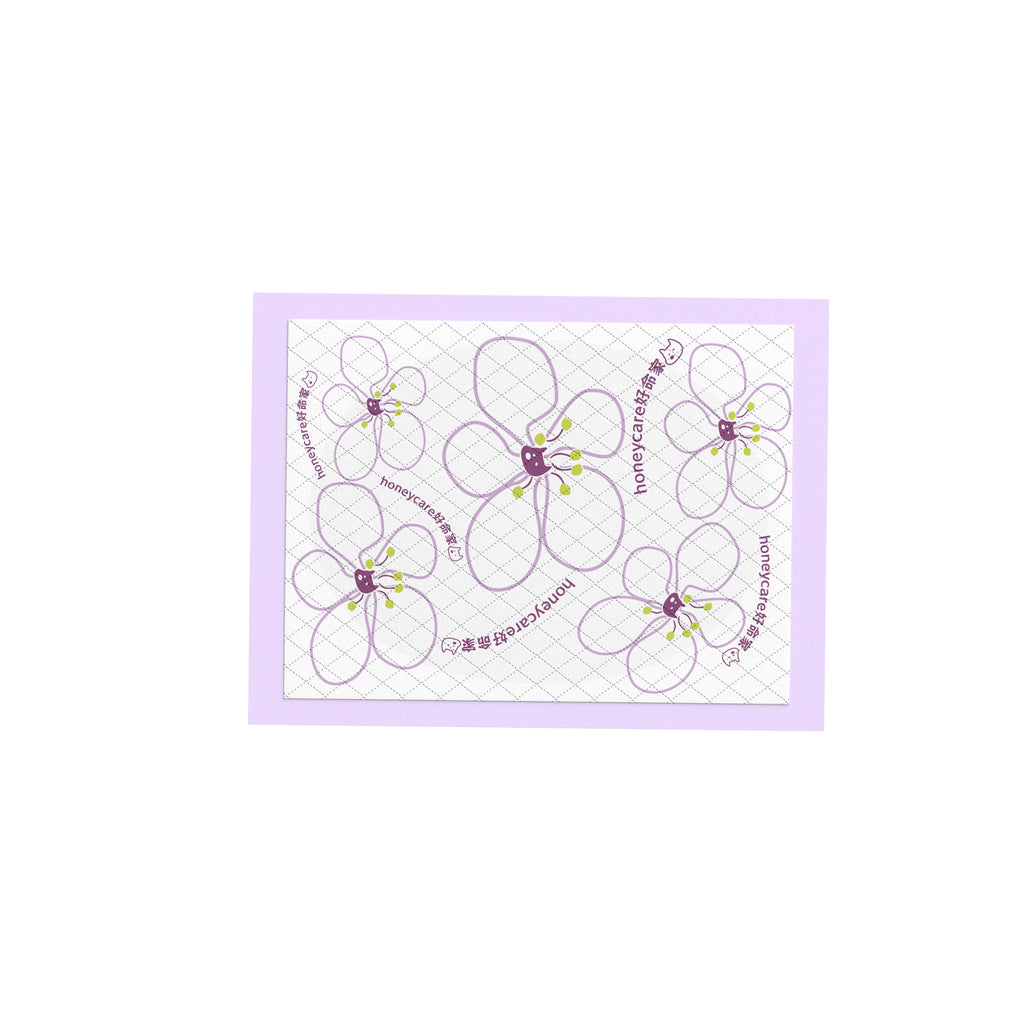 Pee pad with Flower-shaped stickers with a purple border on a white background
