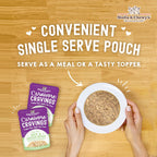 stella and chewy's carnivore cravings single serve pouch and a bowl of wet cat food